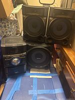 Group view of receiver, subwoofer and two speakers