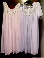 Full view of blush pink nightgown and lavender robe hanging