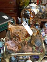 Three glass swan figurines grouped on glass table