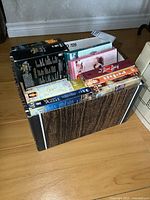 Full view of box showing numerous DVD cases