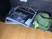 Two packaged collapsible trunk organizers and mosquito net hat