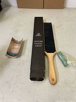 Strop kit components: box, paddle strop, compound, leaflet