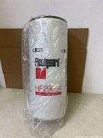 Front view of Fleetguard HF29034 filter sealed in plastic