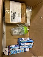 Overview showing shaker bottle, Pawfly air pump box, electric toothbrush box, sealed carton