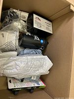 Overview of contents showing Everlast bottle, boxed items, grey pouch