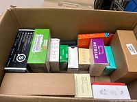 Overview of open cardboard box showing all boxed electronics