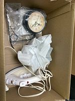 Clock and iron inside box
