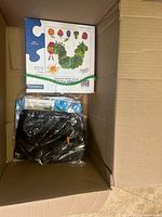 Top view showing puzzle box and sealed accessories