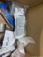 Overview of boxed assorted parts and tools