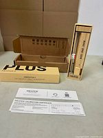 Full contents: probe in charger, outer box, certificate