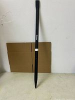 Full view of Westward pry bar leaning against wall