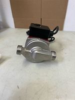 Front view showing both threaded ports