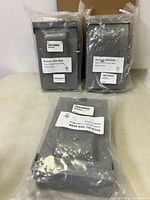 Three sealed Norwesco disconnect boxes on table