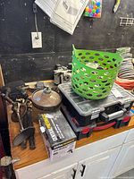 Workbench with toolbox stack, green basket, Central Machinery box, clamps, wheels