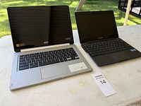 Acer CB5-312T and Samsung XE500C13 laptops open on table