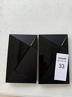 Top view of two identical NVIDIA Shield TV consoles