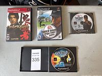 All four PlayStation 2 games displayed: two in original cases, two disc-only