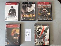 Front view of five PlayStation 2 game cases lined together