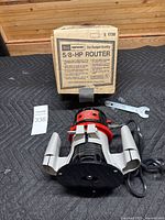 Router, wrench, and original box overview