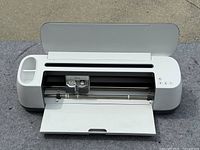 Cricut CXPL301 machine open view showing blade carriage and tray