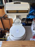 Front view showing Dayton Moneyweight scale with platform and indicator window