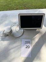 Front view of Google Nest Hub with screen off and power cable