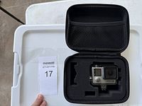 Camera in case showing front display and lens