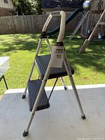 Full view of Gorilla Ladders 2-step folding stool standing open