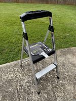 Front view of aluminum 2-step Gorilla ladder with label