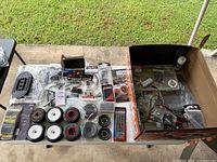 Overview of entire lot on table and chassis in box