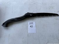 Full view of folded-out saw showing entire tool