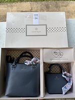 Boxed Nanette Lepore Mom & Me purse set showing both bags