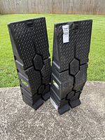 full view of both Rhino Ramps standing upright on concrete