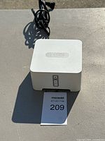 Front view of Sonos Connect with power cord