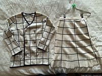 Cream windowpane cardigan front view (skirt also visible)