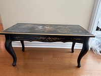 Full view of coffee table front and top artwork