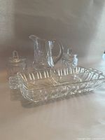 Group shot showing both lidded jars, creamer and relish tray