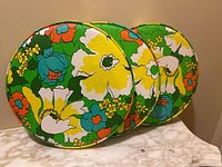 Front view of three round floral cushions
