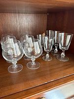 Full set of glasses on shelf