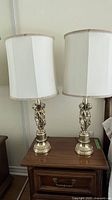 Full view of both matching lamps on nightstand