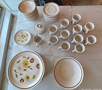 Entire stoneware set laid out on table