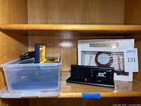 Plastic bin with pen cases, boxed desk clock set, Mont Blanc pen holder