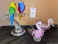 full lot showing bird sculpture and two ducks