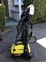 Full view of Karcher 330M pressure washer with cord and hose