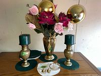 Full lot showing vase with flowers, two candle holders, ashtrays and incense burners