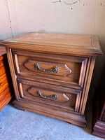 front view of one nightstand showing drawers and hardware