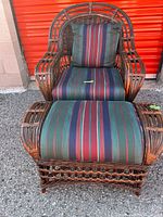 Top view of rattan armchair with back pillow and ottoman, showing matching striped cushions