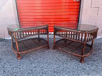Both matching rattan side tables with glass tops shown together