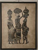 Three-figure batik print in black frame