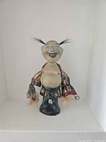 Front view crackle-glaze laughing man figurine